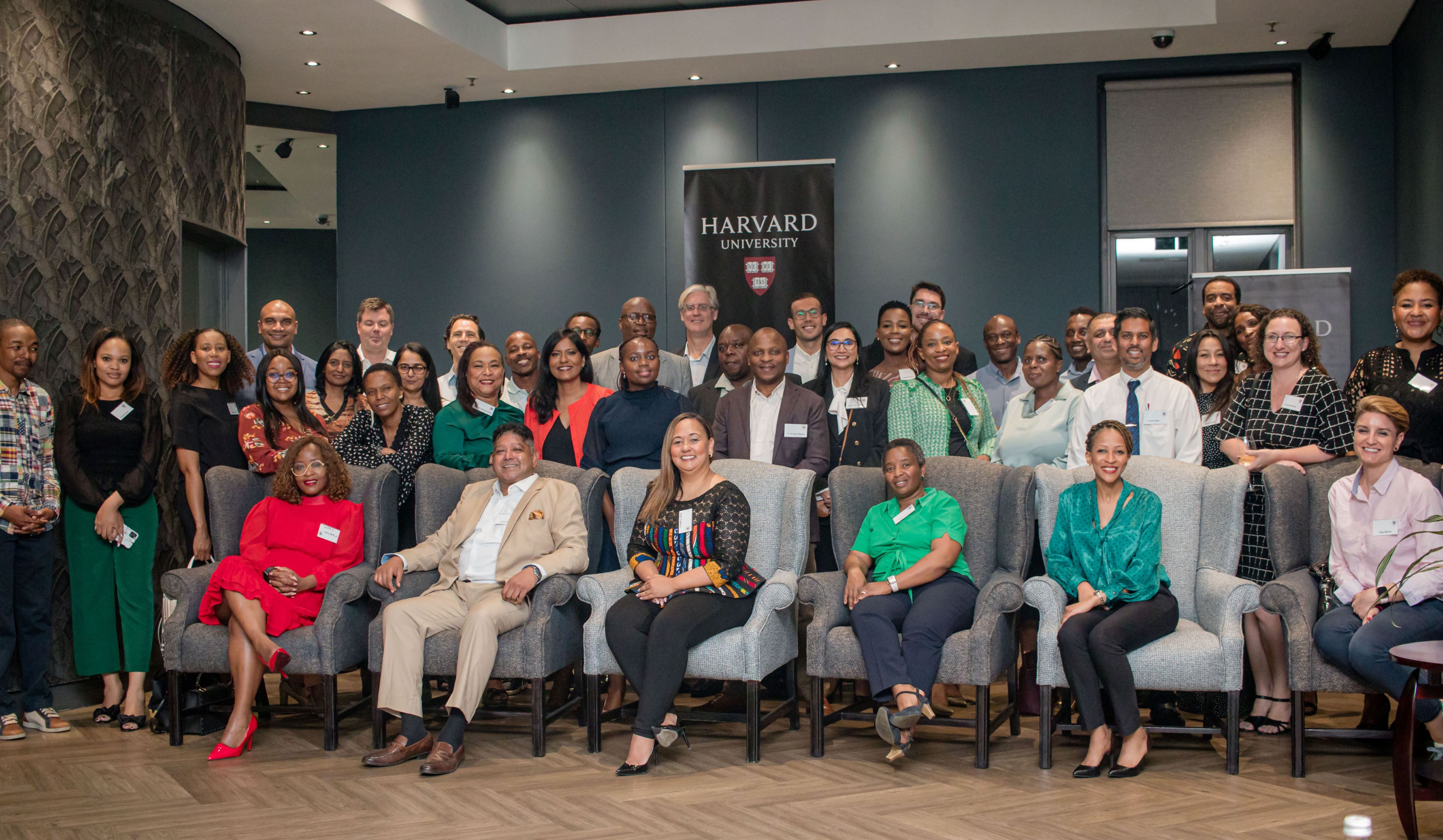 Members of the Harvard Alumni Association of South Africa stand together for a group photo.